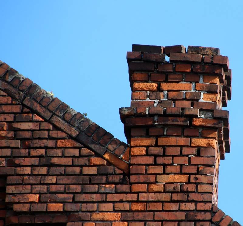 Blog Article - Damaged chimney on an Canton home showing cracks and missing mortar